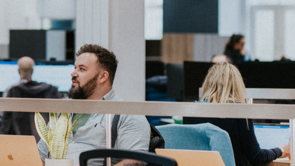 Industry_Marketing_Article_Hero_CTA UCAS staff having a conversation in the Rosehill office, Cheltenham